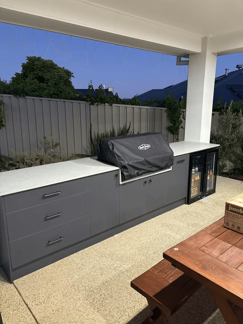 Schmick Black Quiet Running Front Venting Under Bench Heated Glass 2 Door Bar Fridge - Model SK245-B-HD styled in outdoor entertaining setting